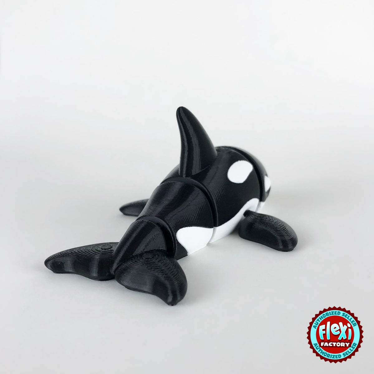 Cute orca killer whale keychain, 3D printed by RU3D – rear three quarter view. Black and white.