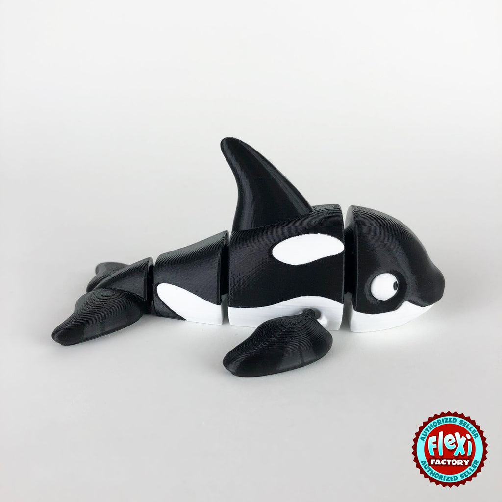 Cute orca killer whale keychain, 3D printed by RU3D – side view facing right. Black and white.