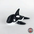 Cute orca killer whale keychain, 3D printed by RU3D – three quarter view facing left. Black and white.