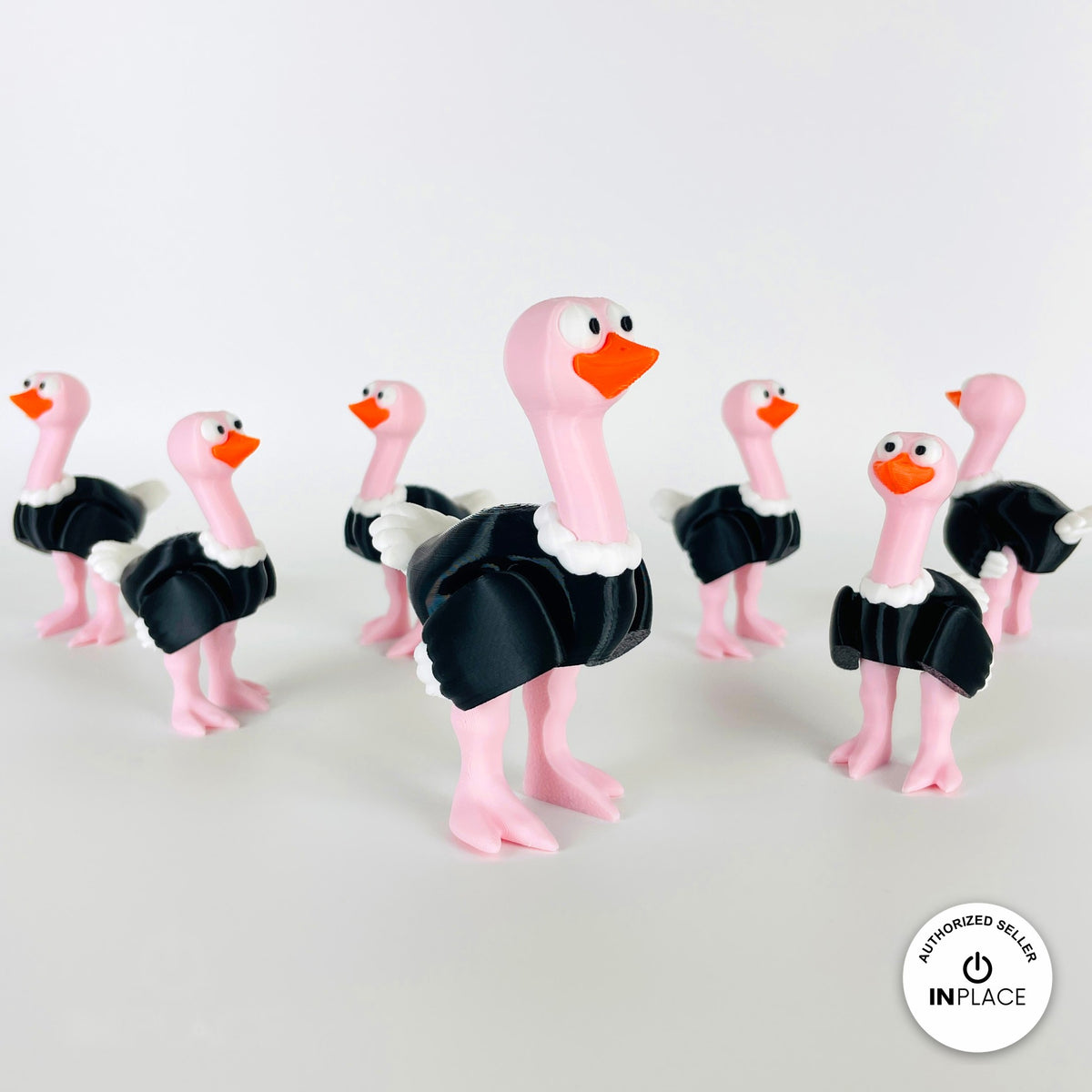 Cute ostrich keychain, 3D printed by RU3D – flock of ostriches. Pink neck and legs with black feathers.