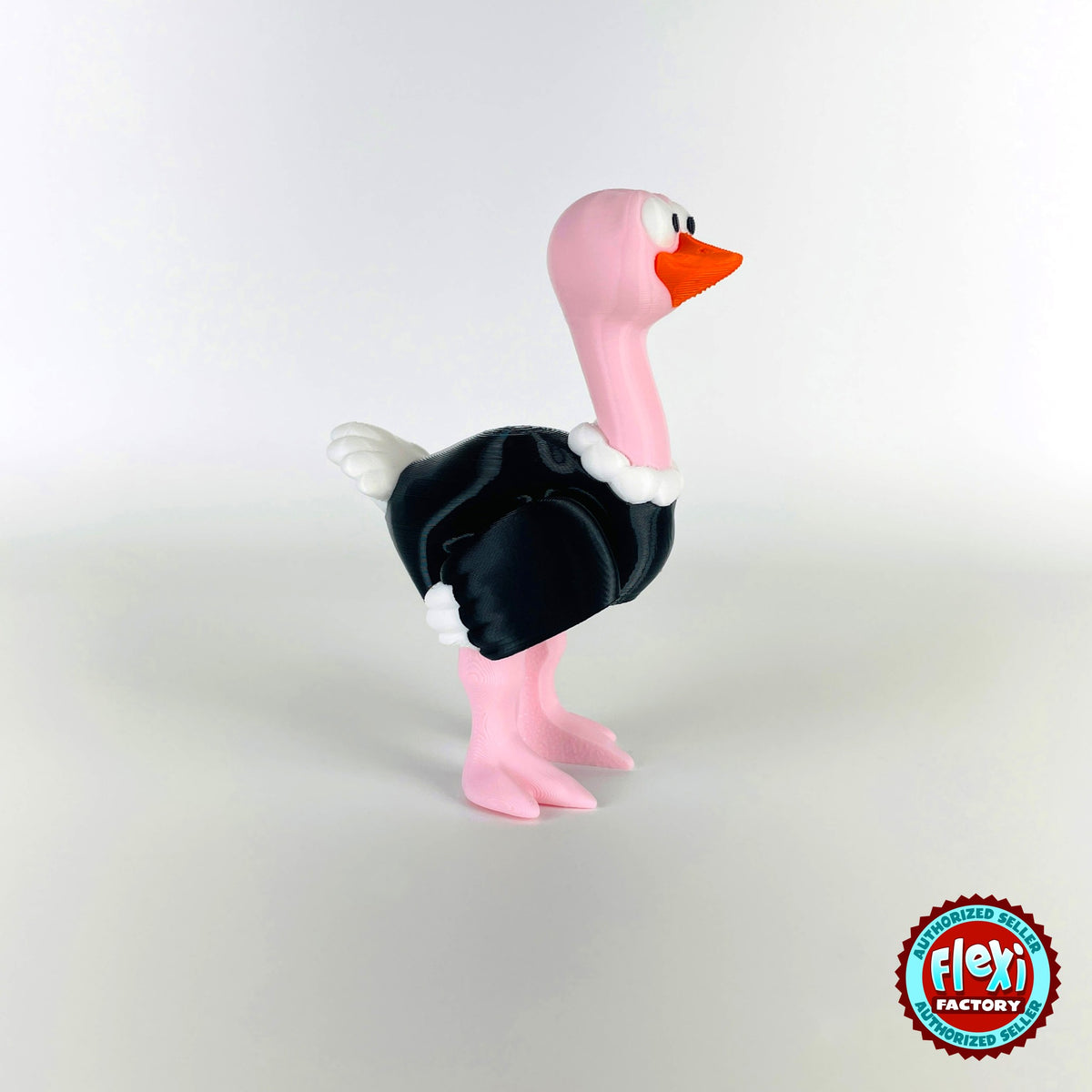Cute ostrich keychain, 3D printed by RU3D – standing three quarter view facing right. Pink neck and legs with black feathers.