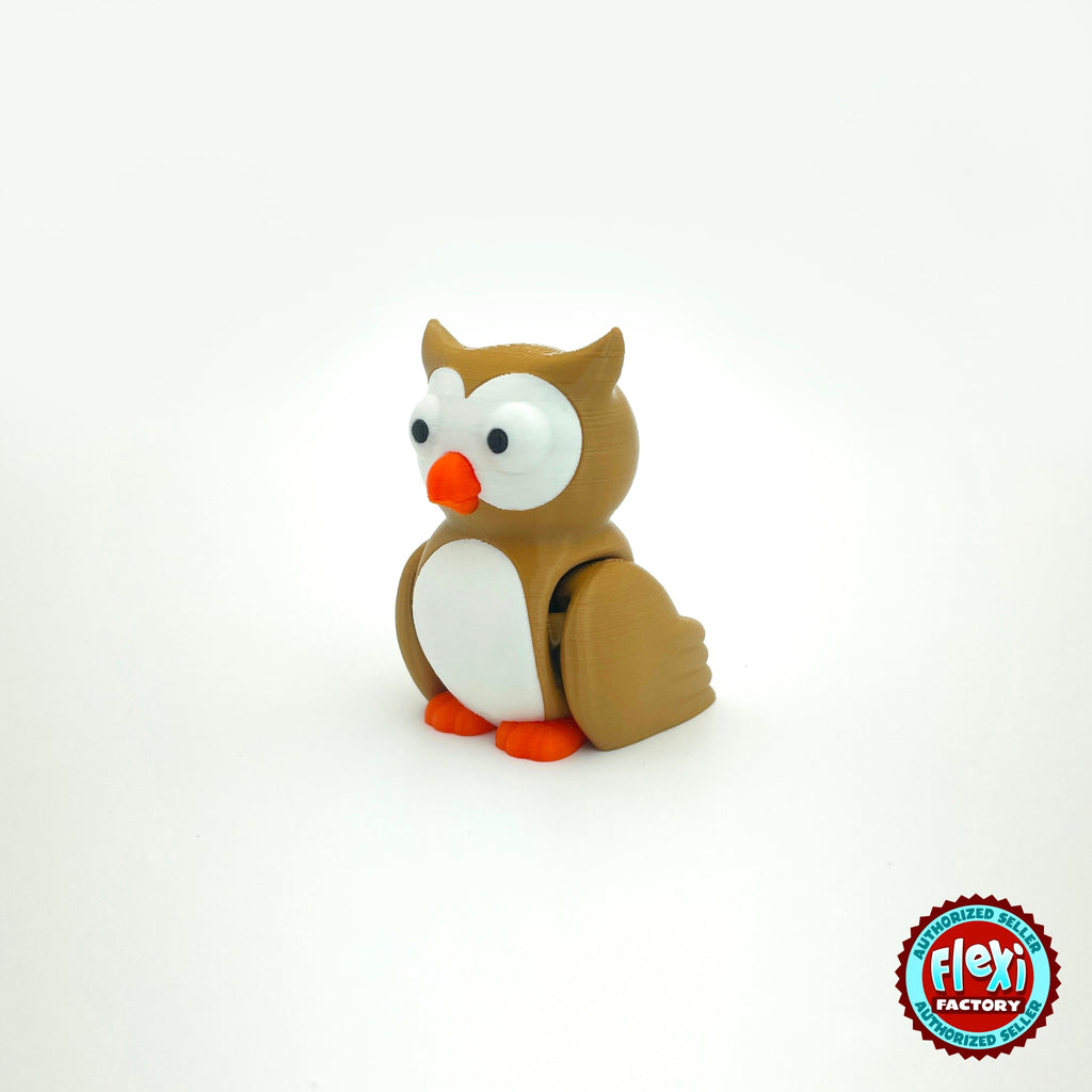 Cute owl keychain, 3D printed by RU3D – three quarter view facing left. Brown with white belly and orange beak, purple witch hat option.