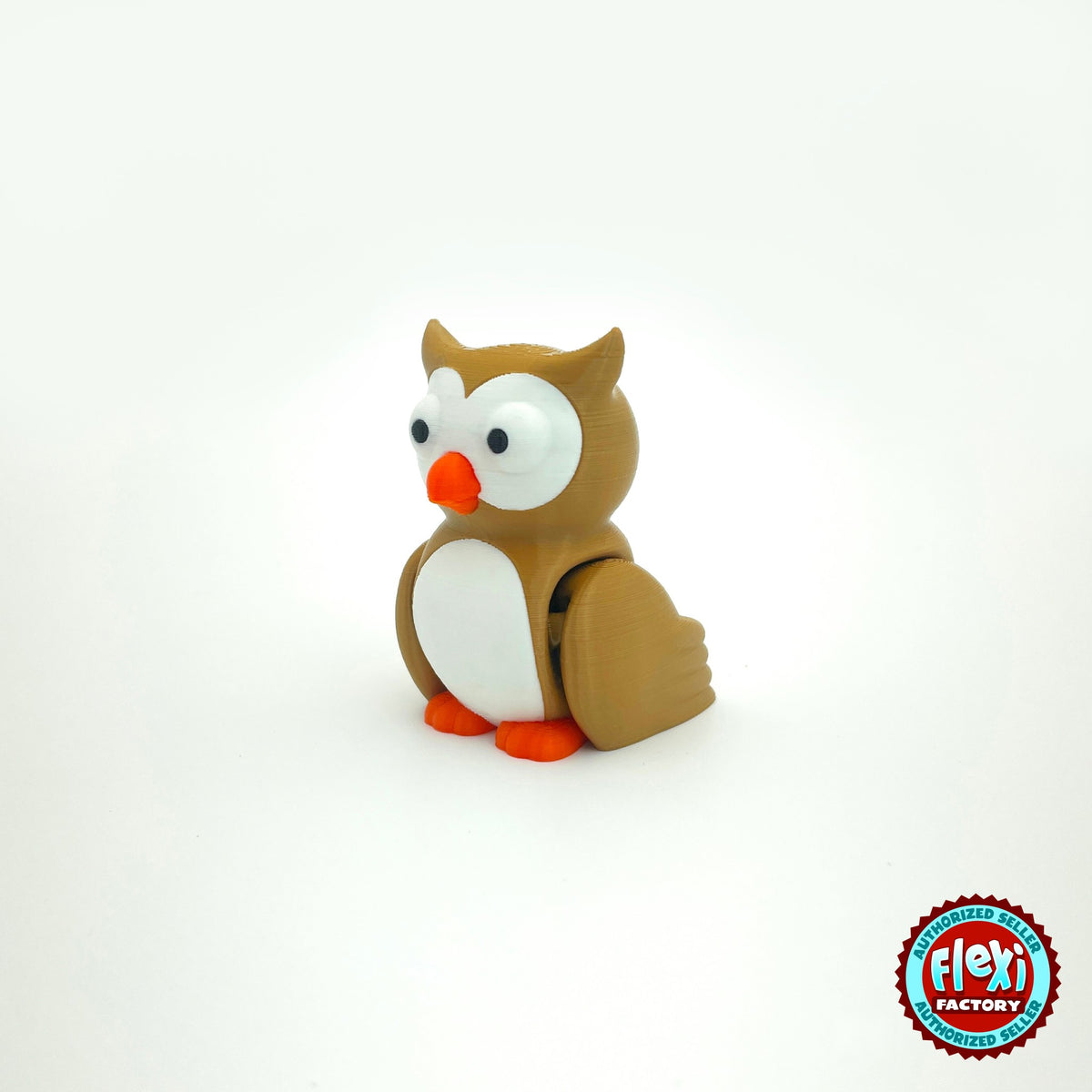 Cute owl keychain, 3D printed by RU3D – three quarter view facing left. Brown with white belly and orange beak, purple witch hat option.