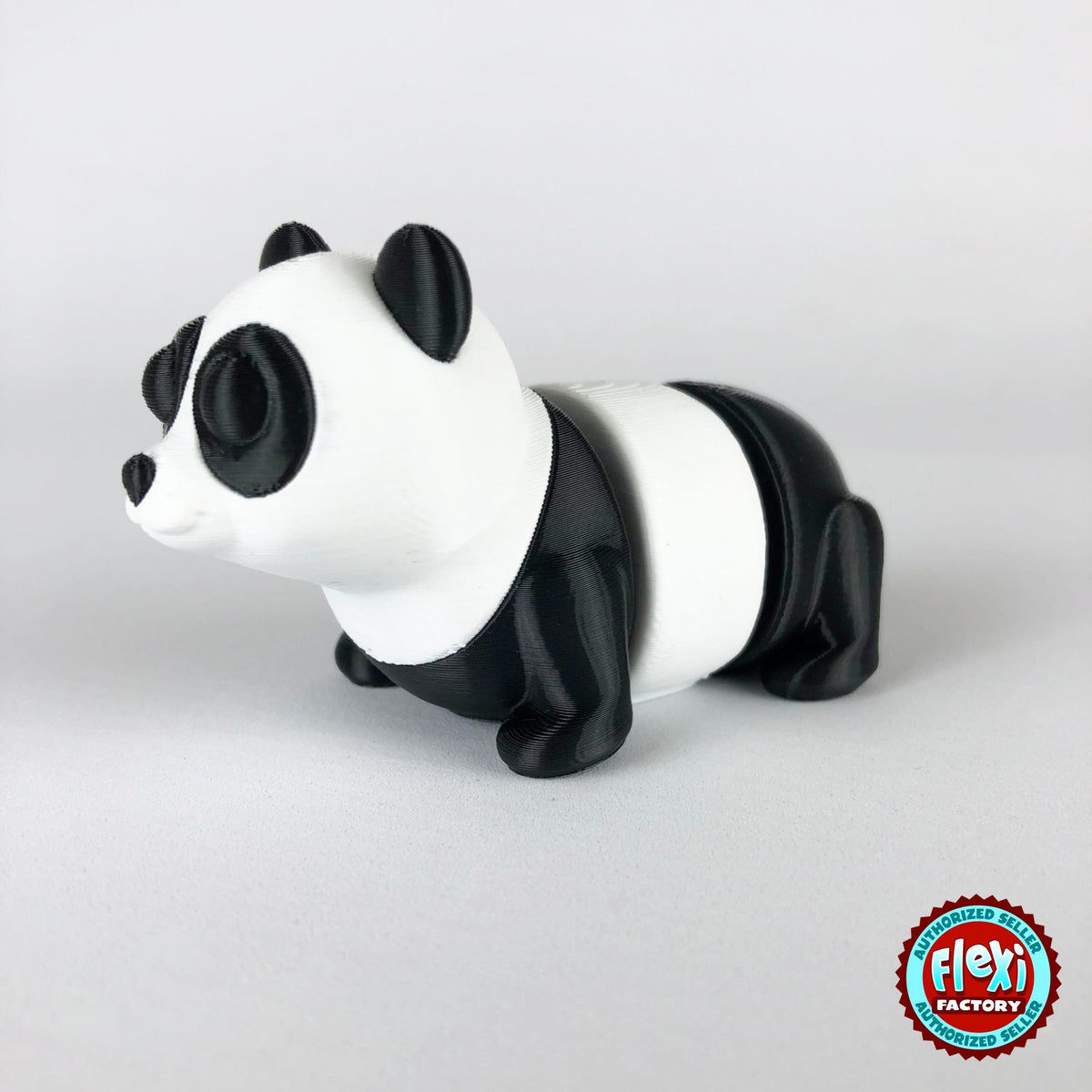 Cute panda keychain, 3D printed by RU3D – dark eyes three quarter view facing left. Black and white.