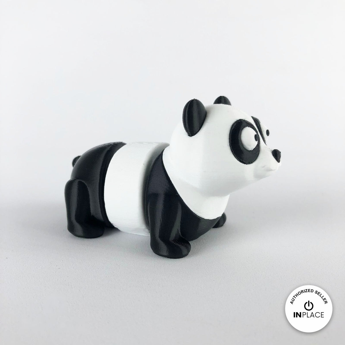 Cute panda keychain, 3D printed by RU3D – side view facing right. Black and white.