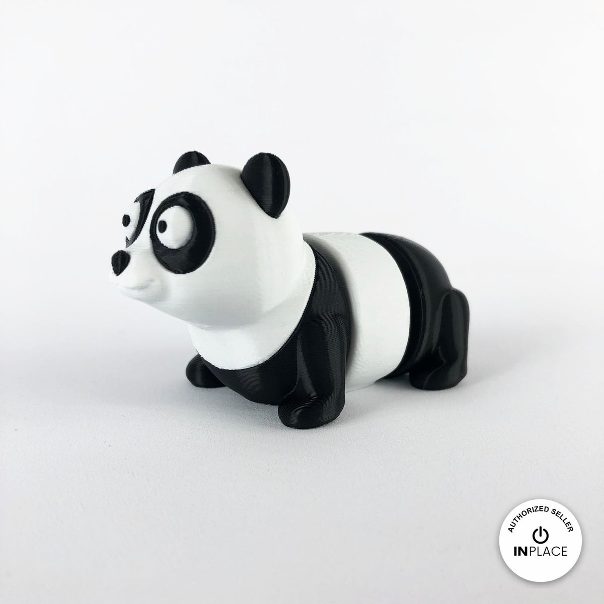 Cute panda keychain, 3D printed by RU3D – three quarter view facing left. Black and white.