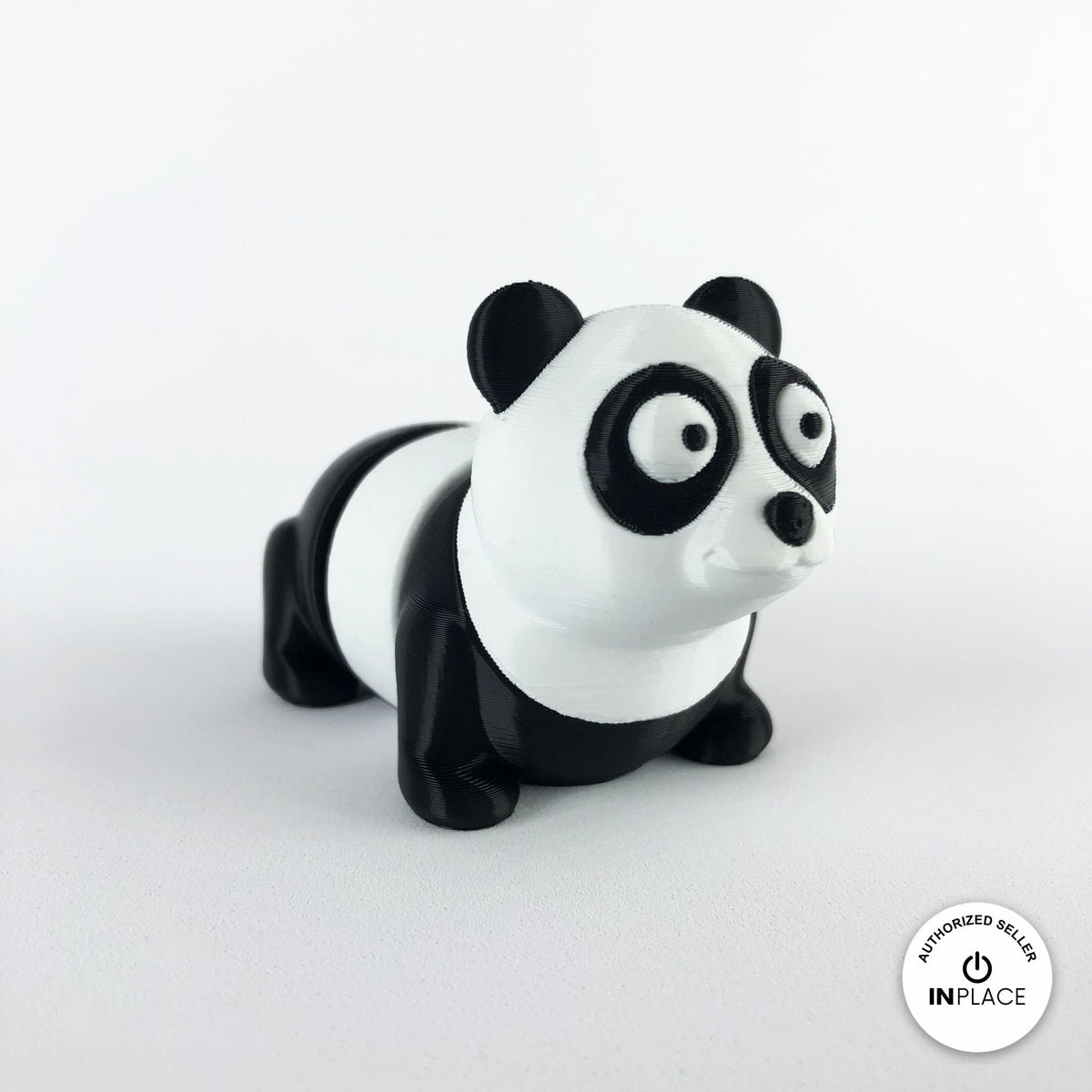 Cute panda keychain, 3D printed by RU3D – three quarter view facing right. Black and white.