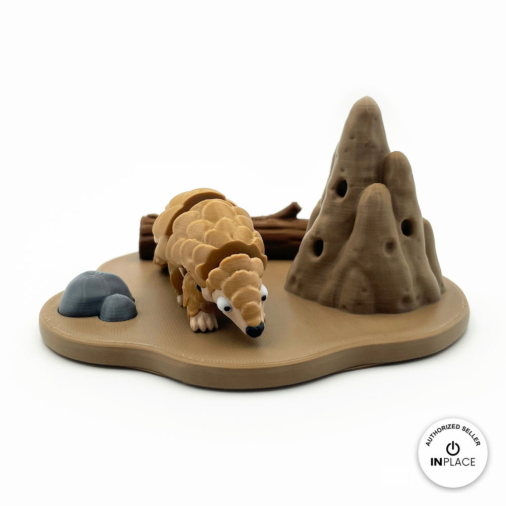 3D printed termite mound platform by RU3D, shown with the Pangolin keychain