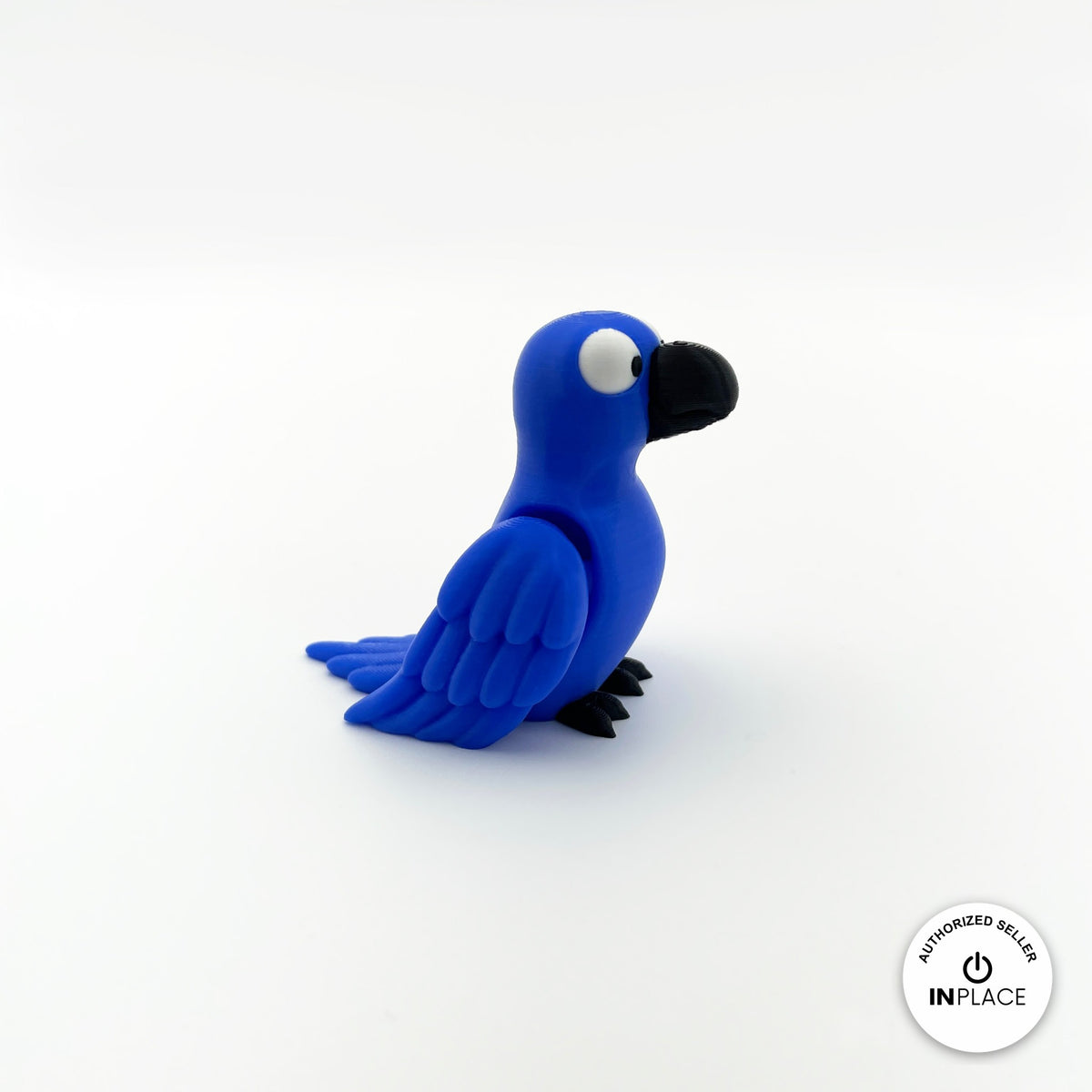 Cute parrot keychain, 3D printed by RU3D – blue parrot three quarter view facing right. Green, blue and red macaw versions.