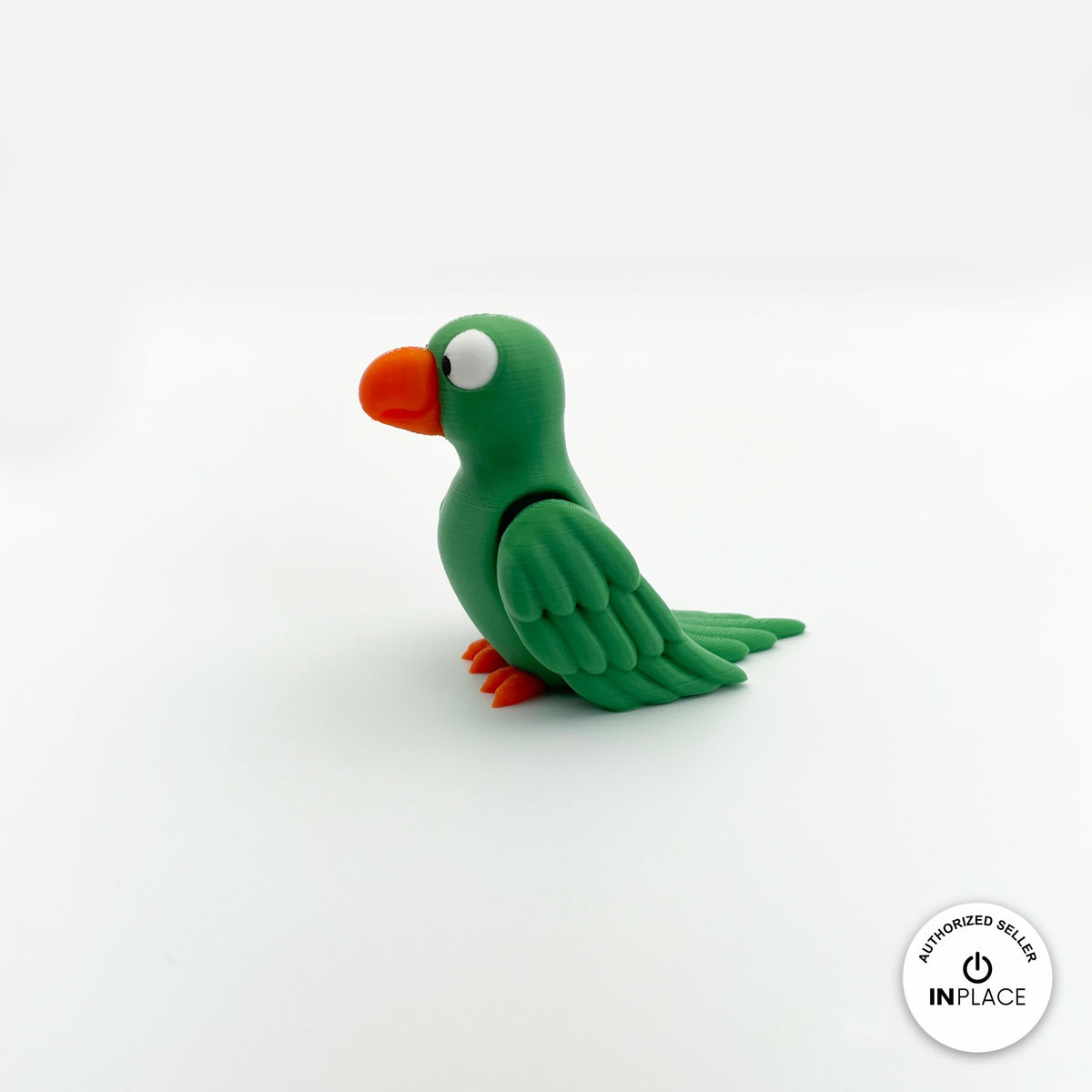 Cute parrot keychain, 3D printed by RU3D – green parrot side view facing left. Green, blue and red macaw versions.