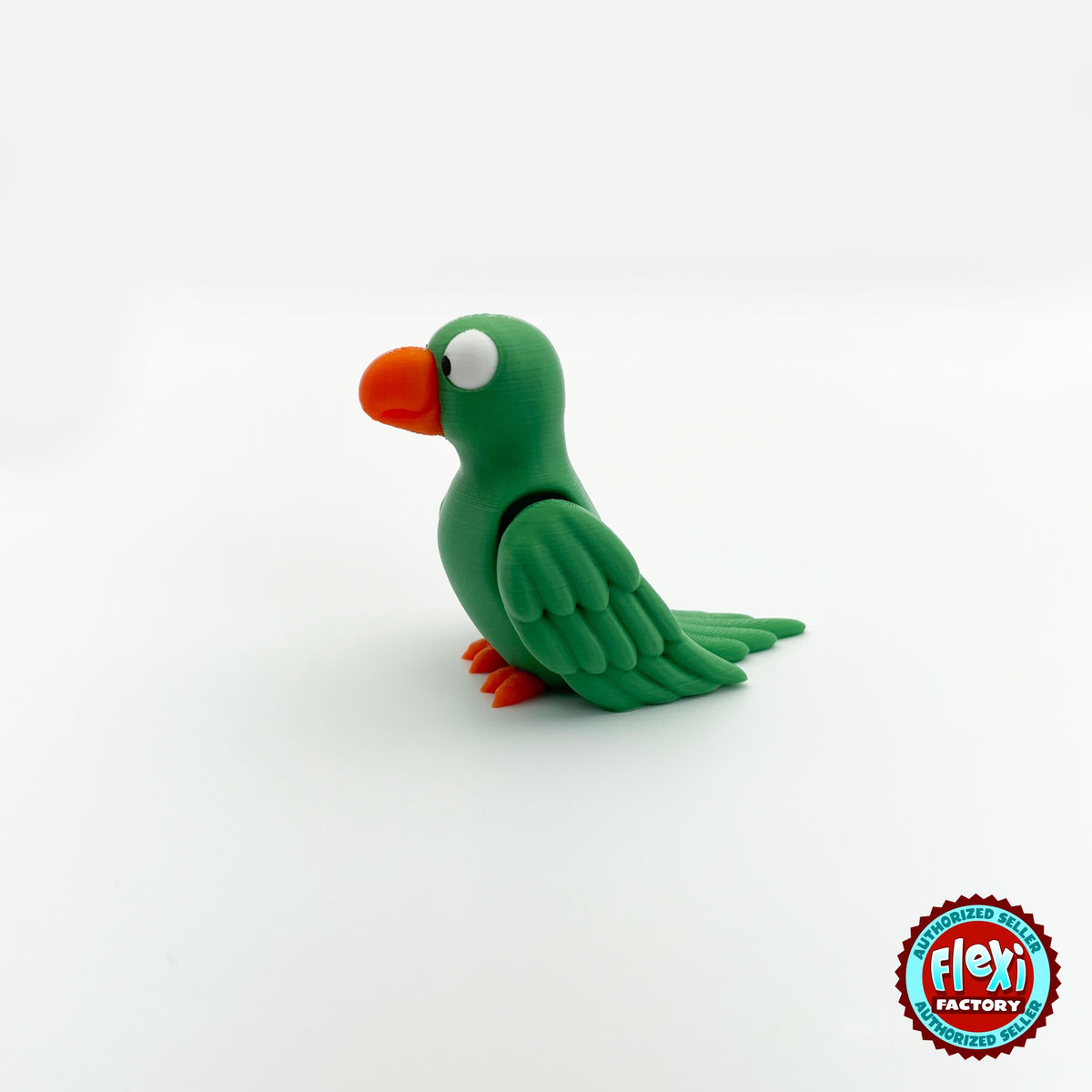 Cute parrot keychain, 3D printed by RU3D – green parrot side view facing left. Green, blue and red macaw versions.