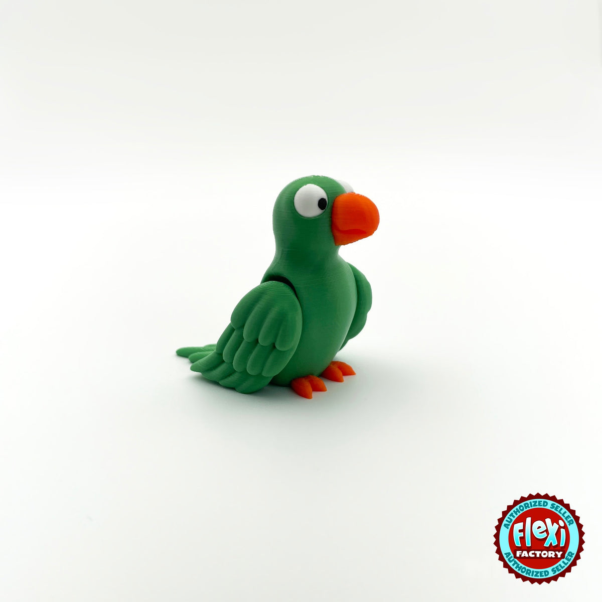 Cute parrot keychain, 3D printed by RU3D – green parrot three quarter view facing right. Green, blue and red macaw versions.