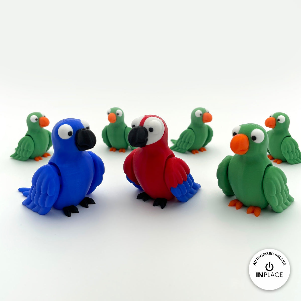 Cute parrot keychain, 3D printed by RU3D – group of green blue and red parrots. Green, blue and red macaw versions.