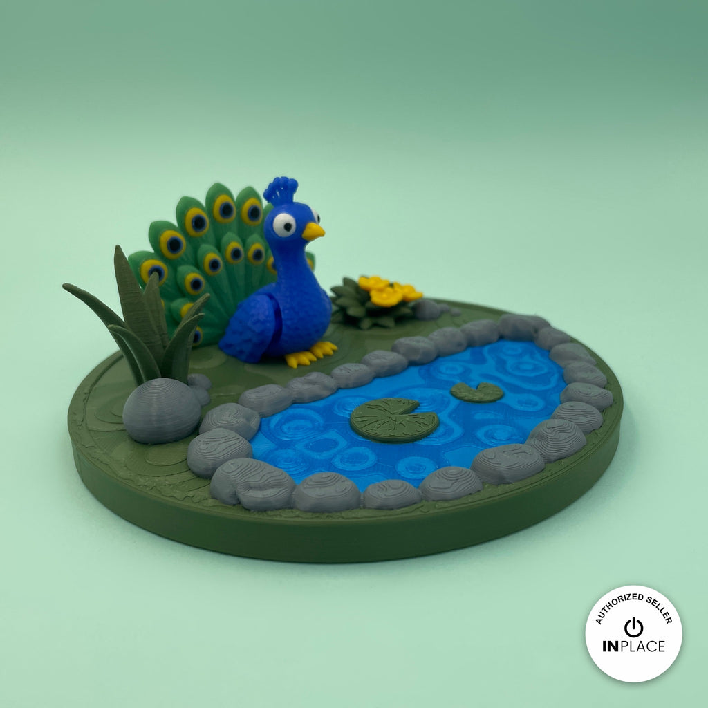 3D printed garden pond platform by RU3D, shown with the Peacock keychain