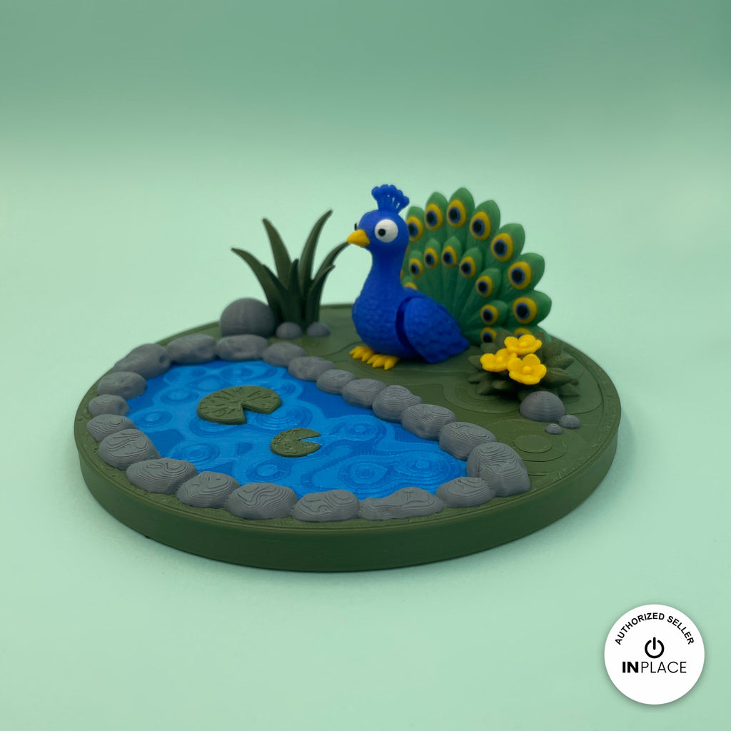 3D printed garden pond platform by RU3D, shown with the Peacock keychain