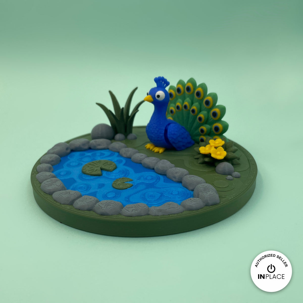 3D printed garden pond platform by RU3D, shown with the Peacock keychain