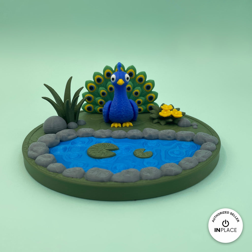 3D printed garden pond platform by RU3D, shown with the Peacock keychain