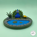 3D printed garden pond platform by RU3D, shown with the Peacock keychain