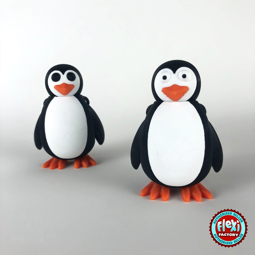 Cute penguin keychain, 3D printed by RU3D – pair of penguins. Black and white with orange beak and feet.