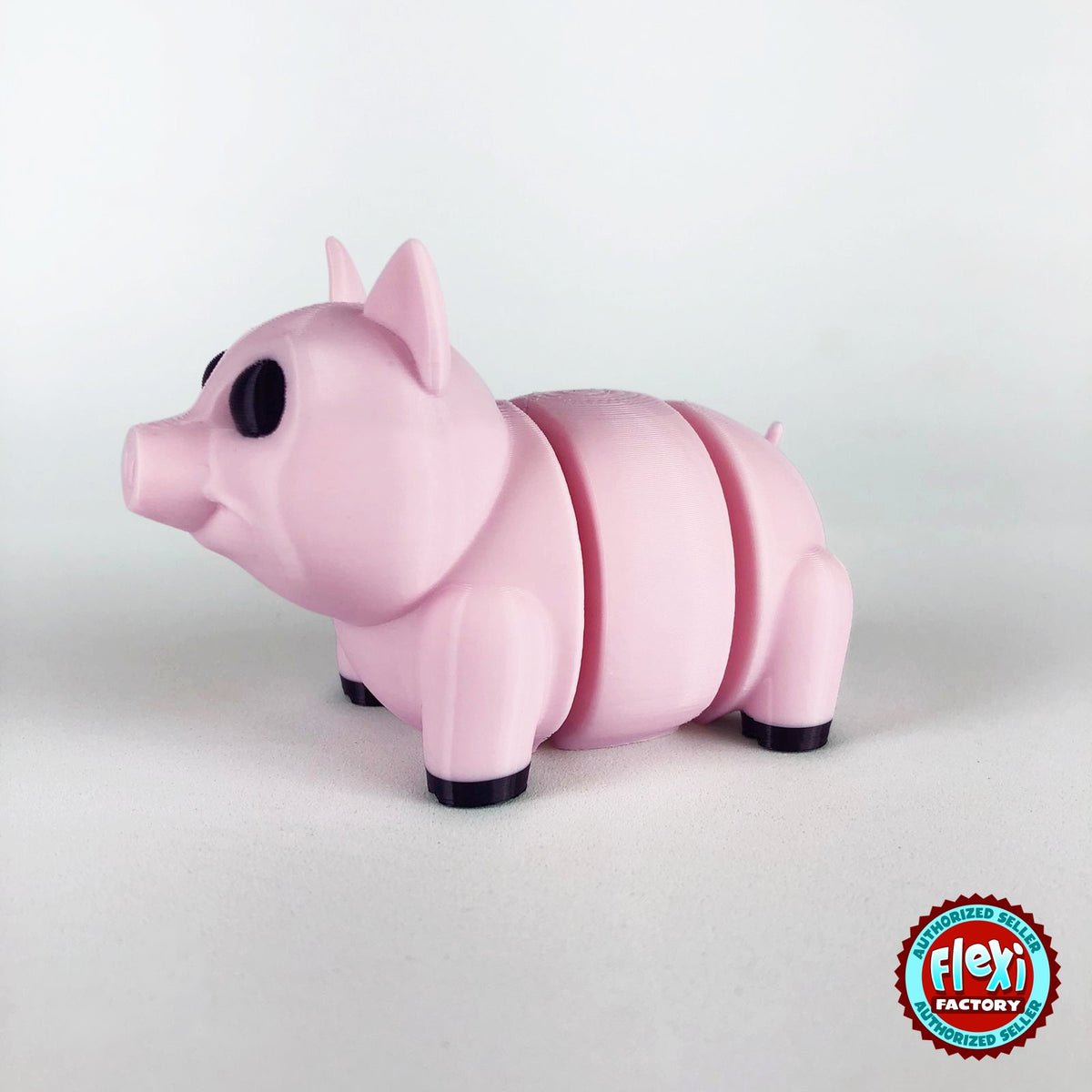 Cute pig keychain, 3D printed by RU3D – dark eyes three quarter view facing left. Pink.
