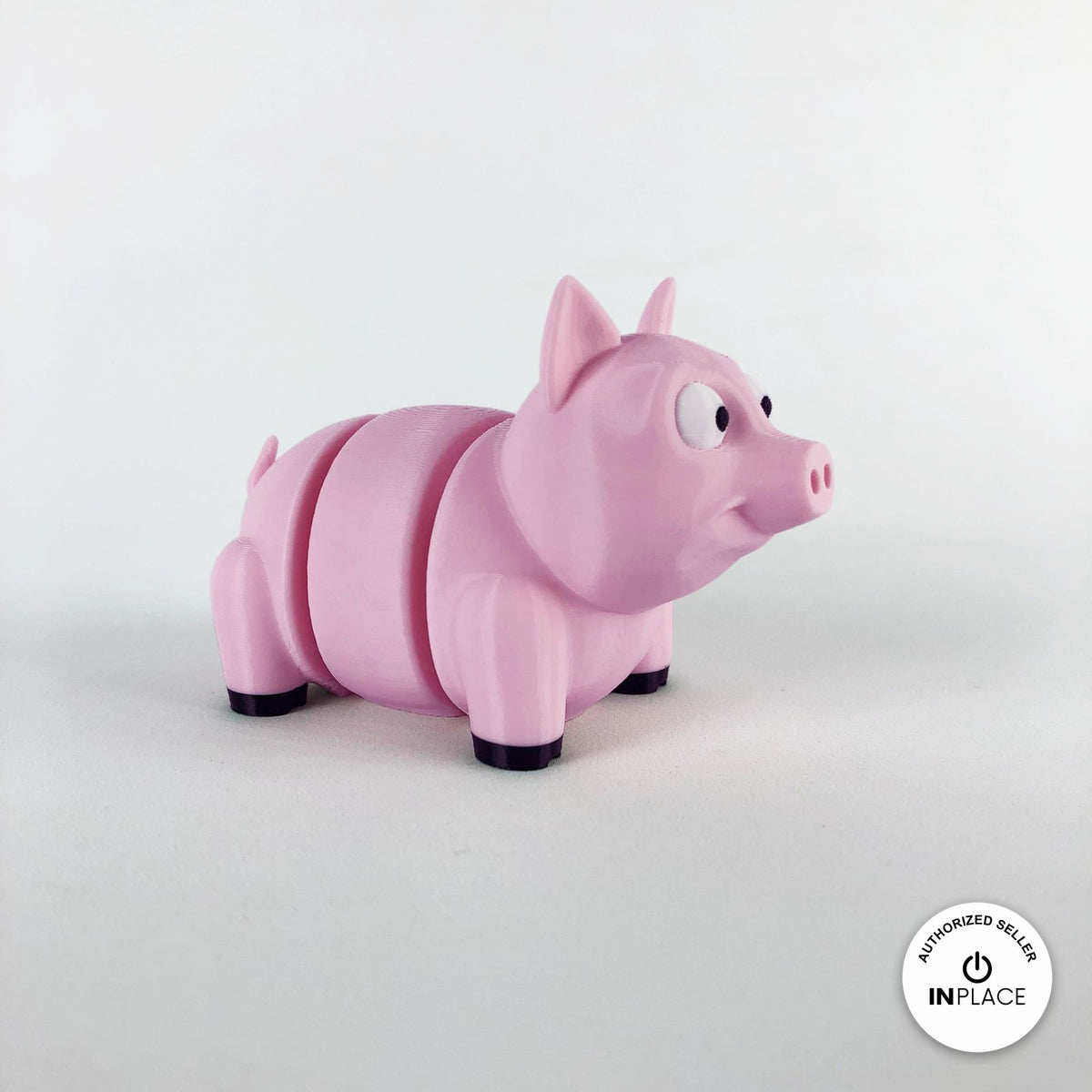 Cute pig keychain, 3D printed by RU3D – three quarter view facing right. Pink.