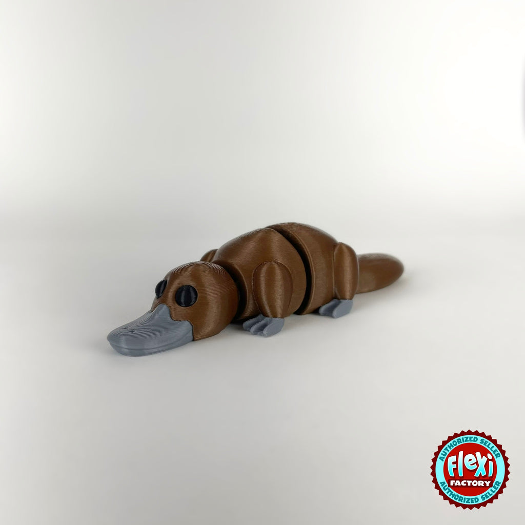 Cute platypus keychain, 3D printed by RU3D – brown dark eyes facing left. Brown with grey bill, also in cream.