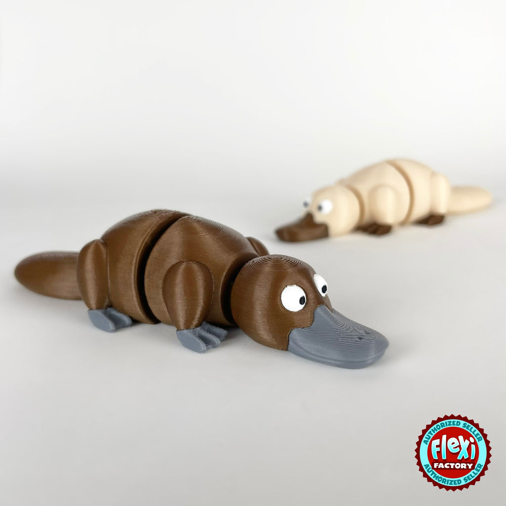 Cute platypus keychain, 3D printed by RU3D – brown platypus with cream behind. Brown with grey bill, also in cream.