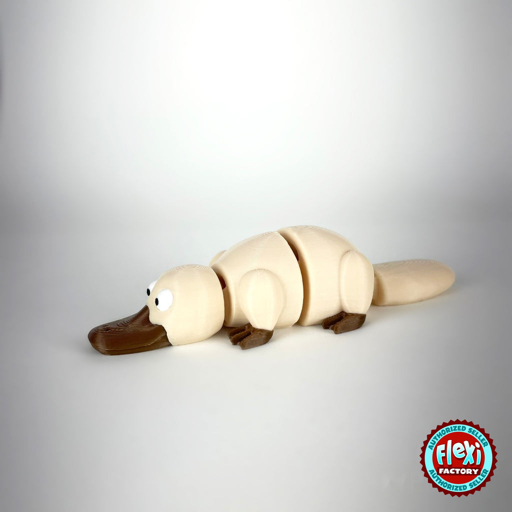 Cute platypus keychain, 3D printed by RU3D – cream three quarter view facing left. Brown with grey bill, also in cream.