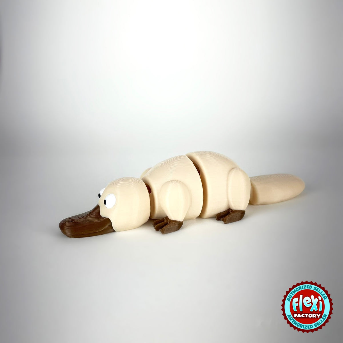 Cute platypus keychain, 3D printed by RU3D – cream three quarter view facing left. Brown with grey bill, also in cream.