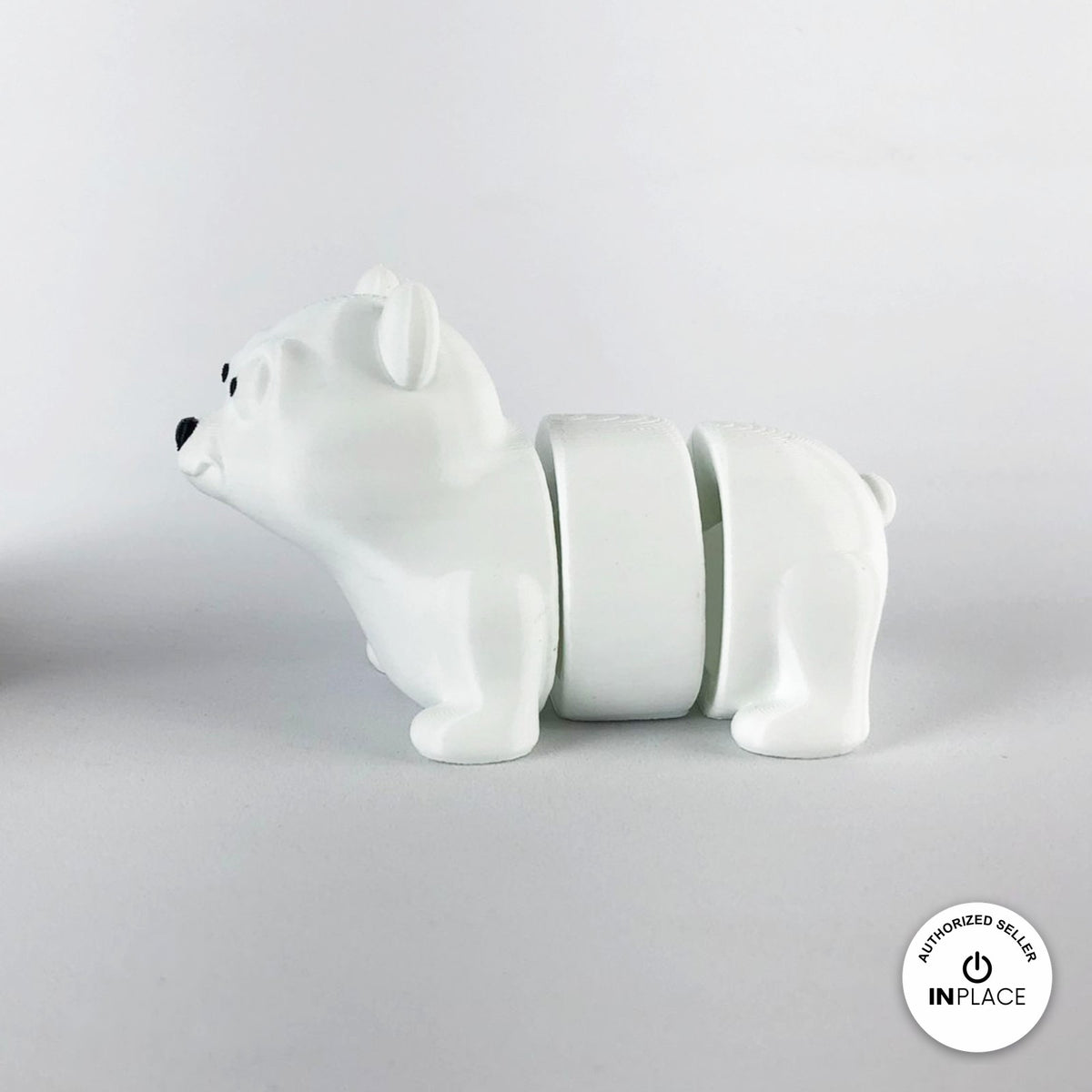 Cute polar bear keychain, 3D printed by RU3D – side view facing left. White.