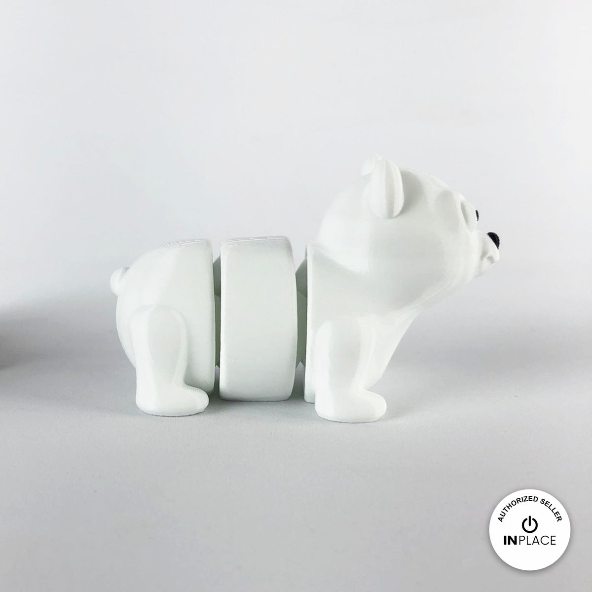 Cute polar bear keychain, 3D printed by RU3D – side view facing right. White.