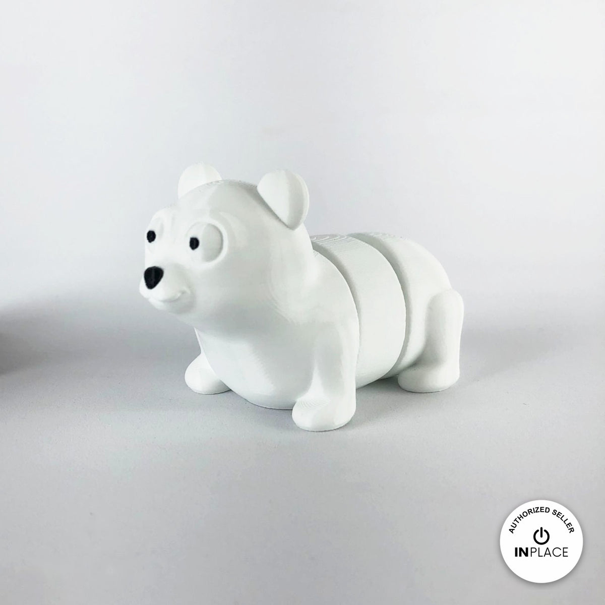Cute polar bear keychain, 3D printed by RU3D – three quarter view facing left. White.