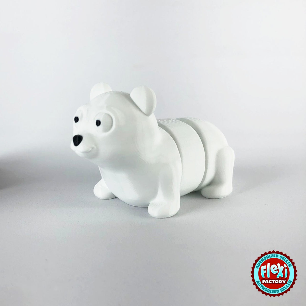 Cute polar bear keychain, 3D printed by RU3D – three quarter view facing left. White.