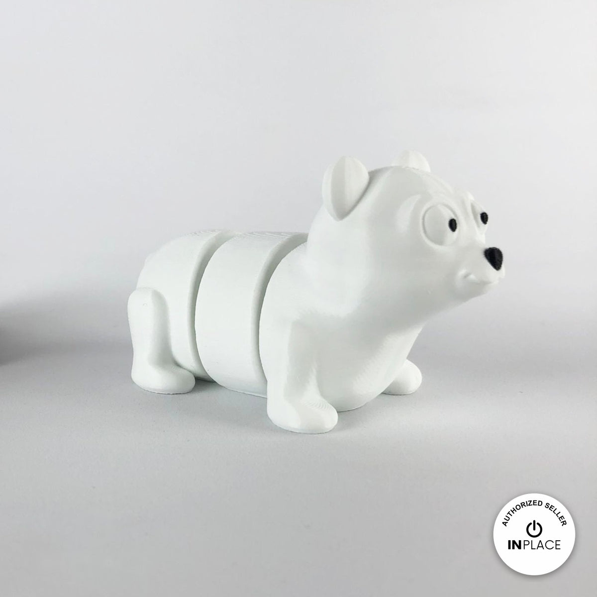 Cute polar bear keychain, 3D printed by RU3D – three quarter view facing right. White.