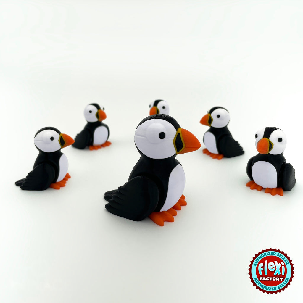 Cute puffin keychain, 3D printed by RU3D – group of puffins. Black and white with orange beak and feet.