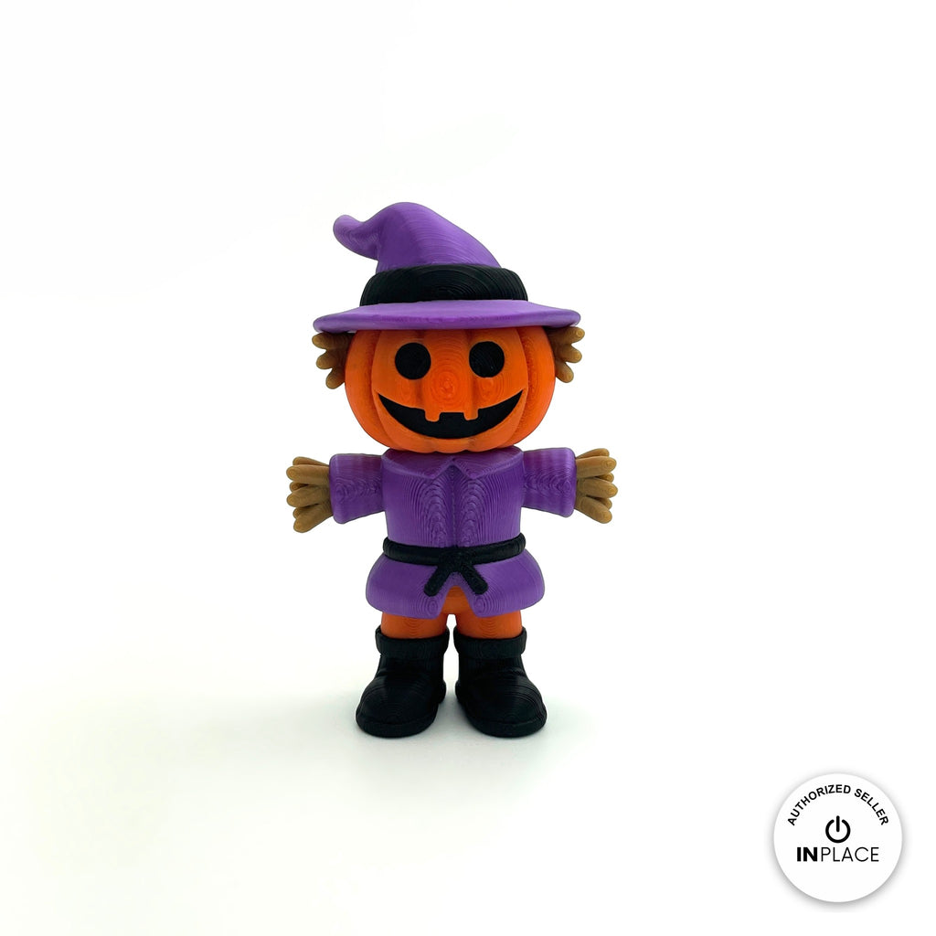 Cute pumpkin scarecrow keychain, 3D printed by RU3D – front view arms out. Orange pumpkin head with purple hat and outfit.
