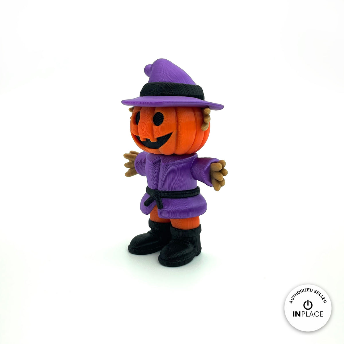 Cute pumpkin scarecrow keychain, 3D printed by RU3D – three quarter view facing right. Orange pumpkin head with purple hat and outfit.