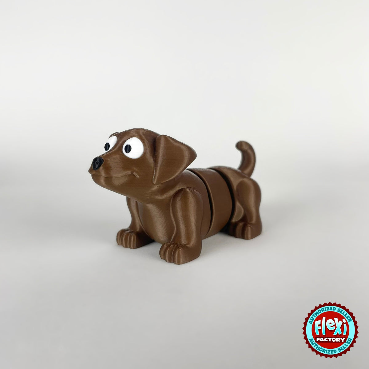 Cute puppy dog keychain, 3D printed by RU3D – brown puppy three quarter view facing left. White with brown patches, also in brown.