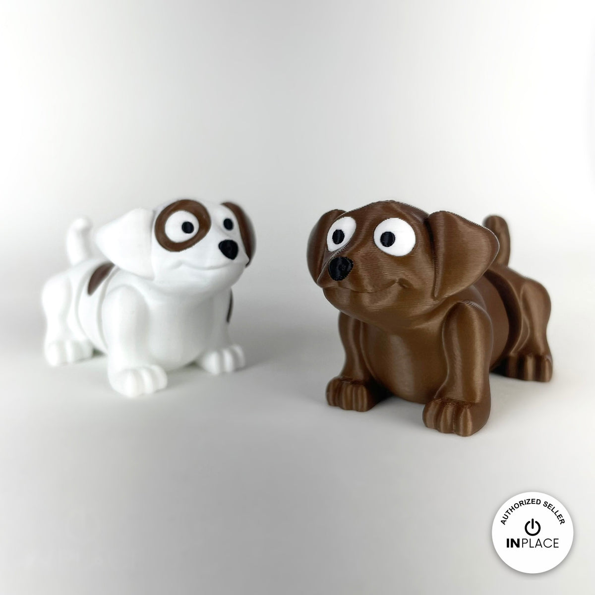 Cute puppy dog keychain, 3D printed by RU3D – pair of puppies front view. White with brown patches, also in brown.