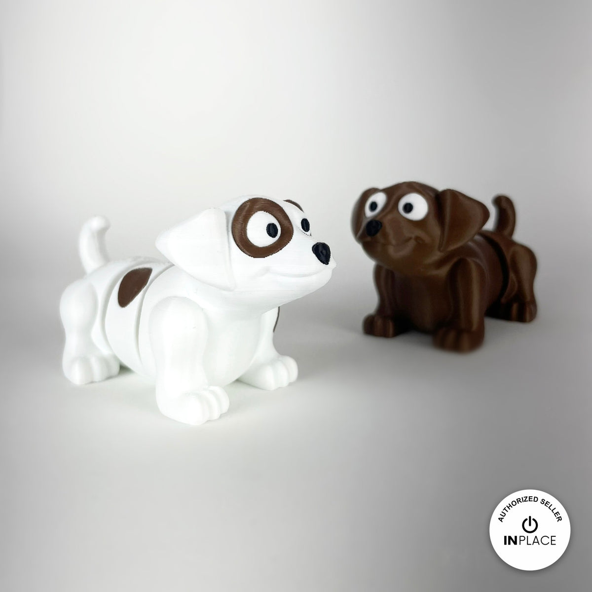 Cute puppy dog keychain, 3D printed by RU3D – white and brown puppies together. White with brown patches, also in brown.