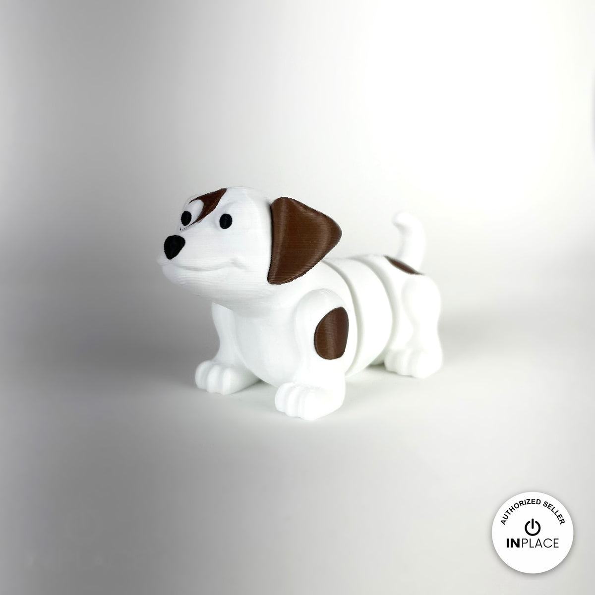 Cute puppy dog keychain, 3D printed by RU3D – white puppy three quarter view facing left. White with brown patches, also in brown.