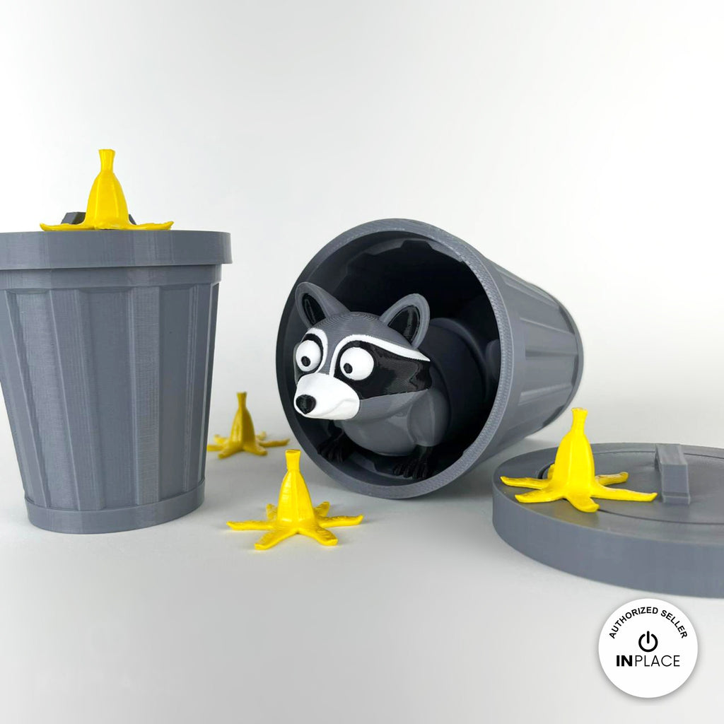 3D printed banana peel accessory by RU3D, shown with the Raccoon keychain