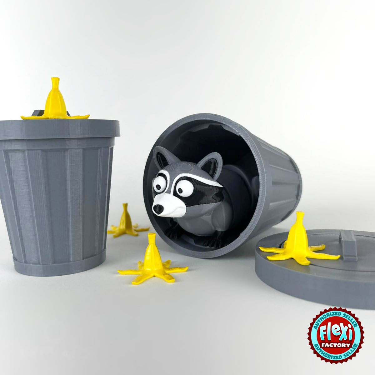 Cute raccoon keychain, 3D printed by RU3D – inside tipped over trash can. Grey and black with trash can playset.