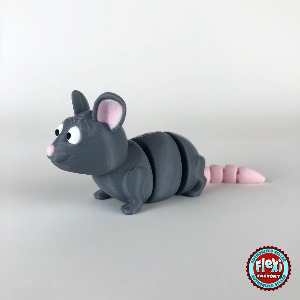 Cute rat keychain, 3D printed by RU3D – three quarter view facing left. Grey with pink ears and tail.