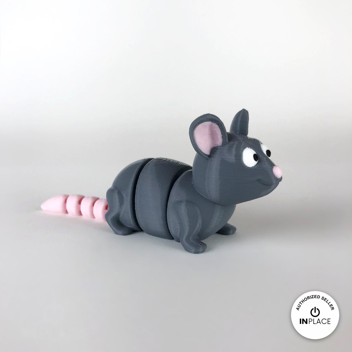 Cute rat keychain, 3D printed by RU3D – three quarter view facing right. Grey with pink ears and tail.
