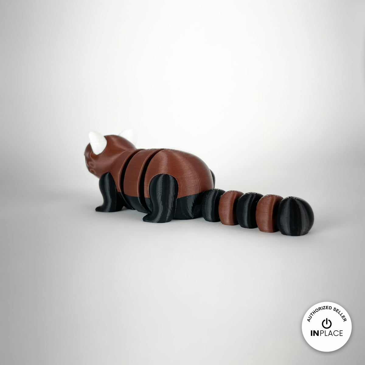 Cute red panda keychain, 3D printed by RU3D – rear three quarter view. Reddish brown, black and white.