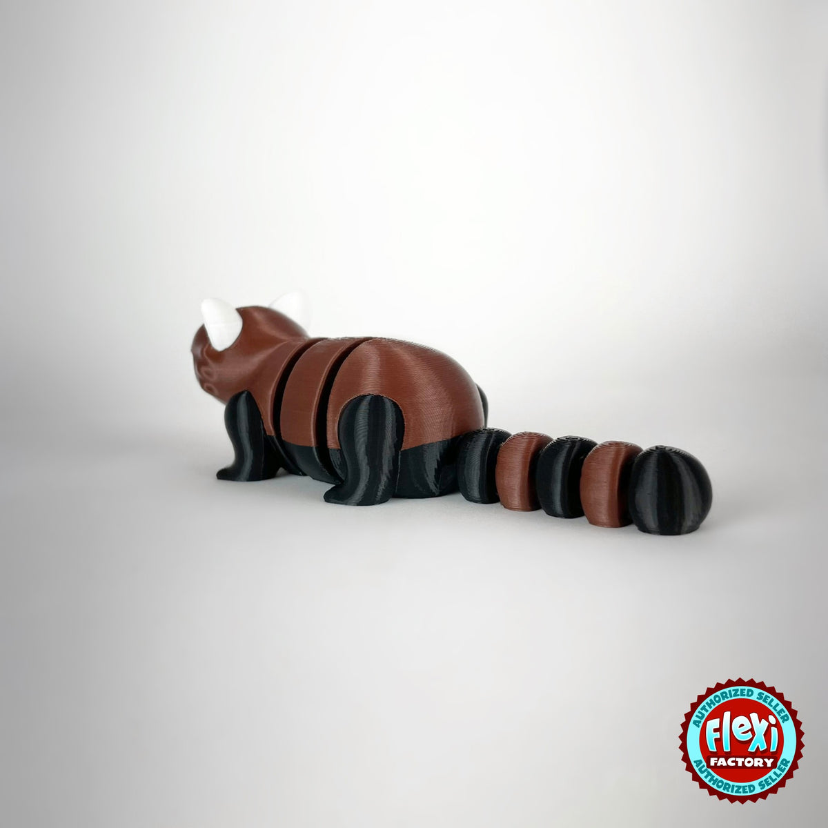 Cute red panda keychain, 3D printed by RU3D – rear three quarter view. Reddish brown, black and white.
