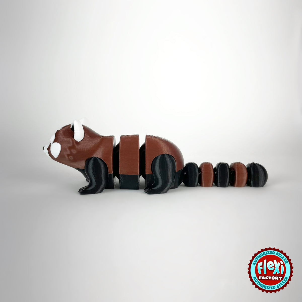 Cute red panda keychain, 3D printed by RU3D – side view facing left. Reddish brown, black and white.