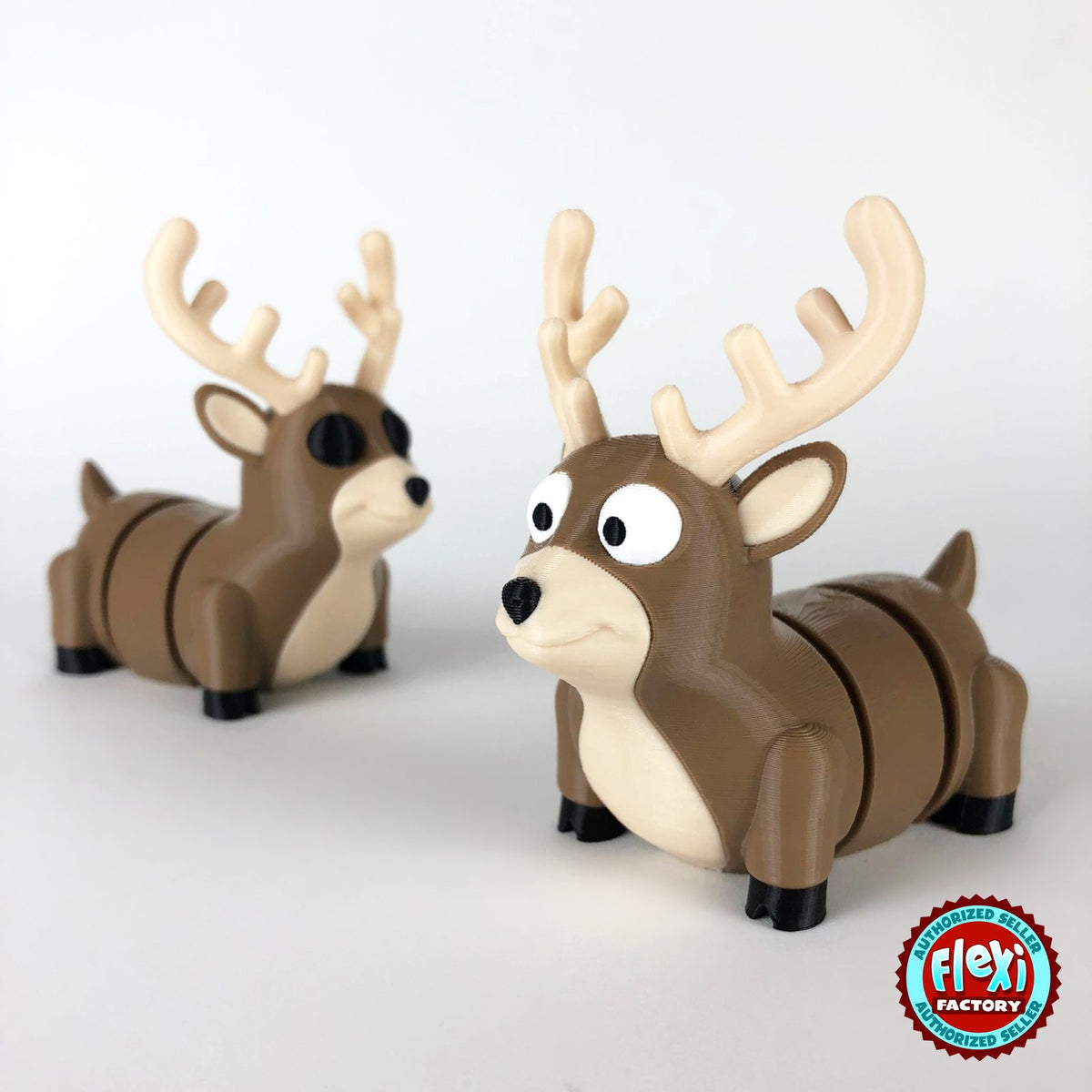 Cute reindeer keychain, 3D printed by RU3D – pair of reindeer. Brown with cream antlers and chest.