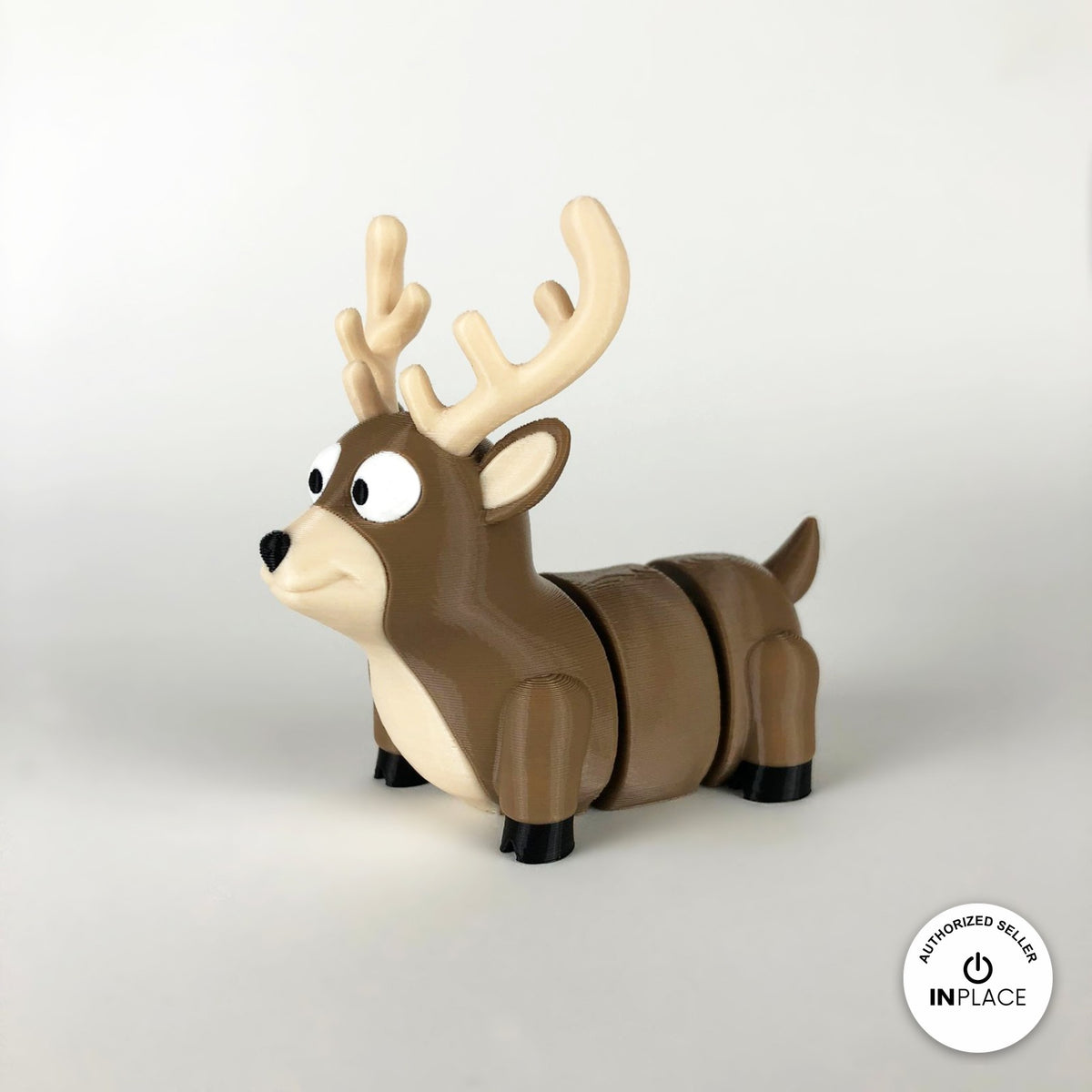 Cute reindeer keychain, 3D printed by RU3D – three quarter view facing left. Brown with cream antlers and chest.